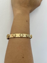 Brazalete dorada flor