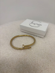 brazalete clavo dorado detalle circonita